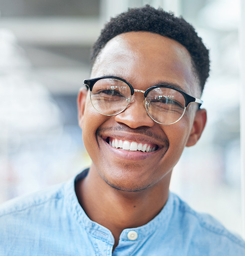 Young man smiling.