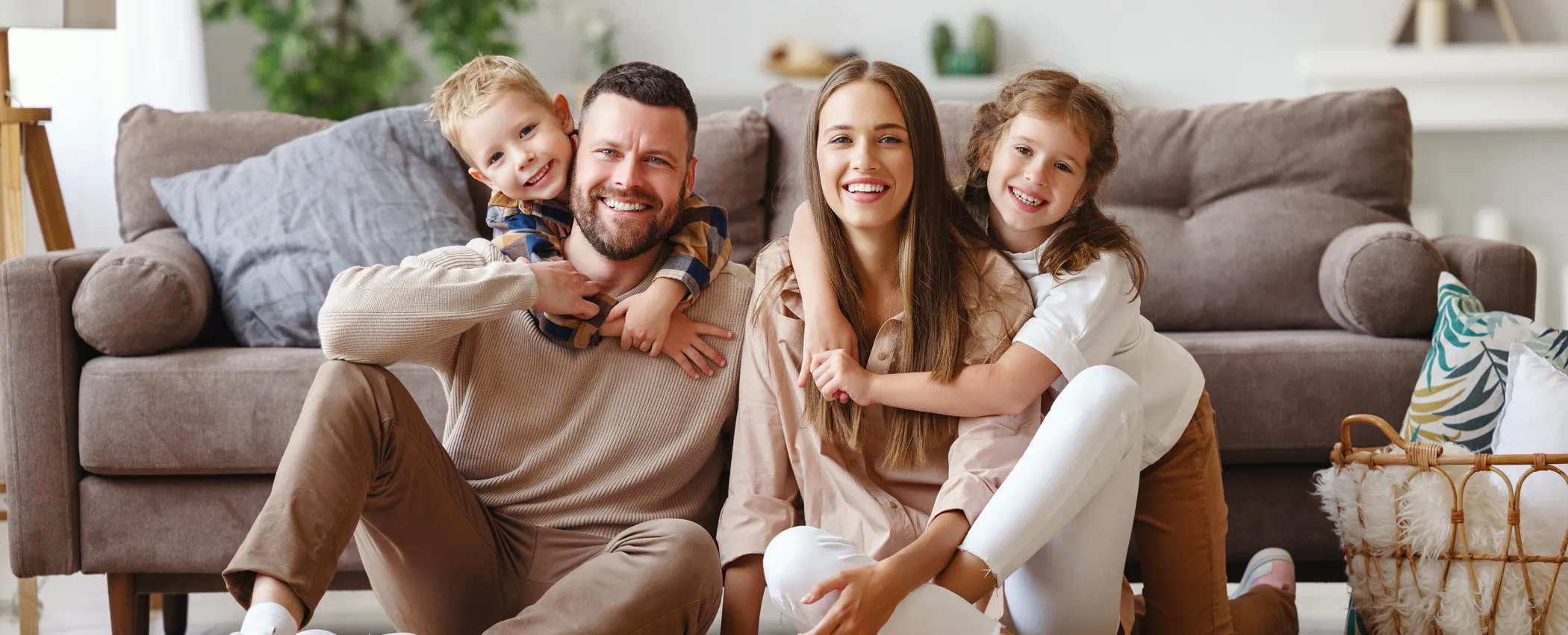 Smiling family in living room